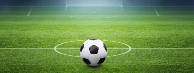 A football in the middle of a field.